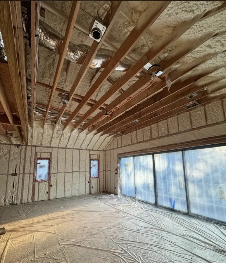 Interior walls and ceiling insulated with spray foam during new construction in Alliance